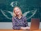 School wings and dream. Teenage students with school notebook. Woman working on laptop computer over chalkboard