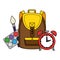 schoolbag with alarm clock and paint supplies