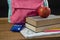 Schoolbag, supplies and apple on wooden table