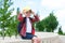 A schoolboy with a book on his head is like a roof on the street on the way to school