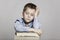 Schoolboy fell asleep at the table with books, toning