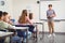 Schoolboy giving presentation in classroom