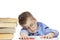 Schoolboy in glasses sleeps on the books for doing homework. Close-up. Isolated on a white background