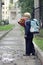 Schoolboy on his way to the school. Boy going to the first class in his school on the path. Children and education in the city