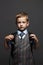 Schoolboy with knapsack.stylish funny child in suit and tie. ready to school