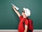 Schoolboy with paper plane play near a blackboard, empty space, education concept