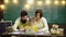 Schoolboy and parents studying. Cute little kid boy learning with parents. Mother father and children drawing at home