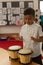 Schoolboy playing bongo in a classroom