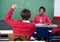 Schoolboy Raising Hand In Classroom