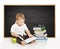 Schoolboy reading book near blackboard, kindergarten school boy, little child on black board background, elementary education con