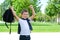 Schoolboy rejoices at the end of school. up a backpack