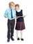Schoolboy and schoolgirl looking at books each other, full length, isolated white background