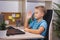 Schoolboy studies at home with laptop. Home learning, online education