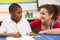 Schoolboy Studying In Classroom With Teacher