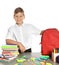 Schoolboy at table with stationery