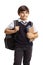 Schoolboy in a uniform with a backpack and books