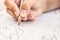 Schoolboy writing close-up. Pencil in the hand of children