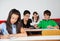 Schoolboys Playing With Paperplane In Classroom