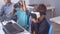 Schoolboys putting on VR glasses at desk