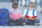 Schoolboys reading books. Kids doing homework outdoors. Back to school concept.