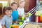 Schoolboys standing near counter