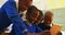 Schoolboys using a tablet during a break at a township school 4k