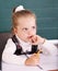 Schoolchild in classroom near blackboard.