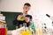 Schoolchild making experiment at table in class