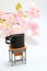 Schoolchild`s rucksacks and cherry blossoms on white background. Black randoseru.