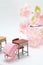 Schoolchild`s rucksacks and cherry blossoms on white background. Pink randoseru.