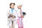 schoolchildren in costumes of doctor and chef standing in white coat and apron