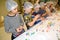Schoolchildren are engaged in the petting of figures from confectionery mastics. Children  `s master class at chocolate factory