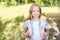 Schoolchildren girl back to school. Happy girl smile with little backpack