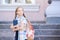 Schoolchildren girl back to school. Happy girl smile with little backpack