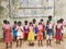 Schoolchildren hoisting their Textbook Festival, marking the distribution of new free textbooks among school students