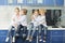 Schoolchildren in lab coats sitting together