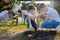 Schoolchildren planting young fruit trees