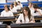 Schoolchildren practicing keyboard in music class