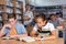 Schoolchildren preparing for lesson in school library