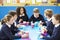 Schoolchildren Sitting At Table Eating Packed Lunch