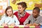 Schoolchildren Studying in classroom with teacher