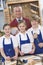 Schoolchildren and teacher in woodwork class