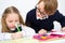 Schoolchildren writing in workbook