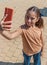 Schooler girl in t-shirt taking selfie outdoors. Shirt mockup