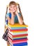 Schoolgirl with backpack holding pile of books.