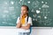 Schoolgirl with backpack looking away on