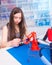 Schoolgirl in the classroom design and development of robots