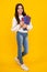 Schoolgirl with copy book posing on isolated background. Literature lesson, grammar school. Intellectual child reader