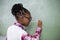 Schoolgirl doing mathematics on chalkboard in classroom