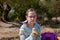 Schoolgirl eating a banana in the street. Alpha generation children will be the driving force behind progress